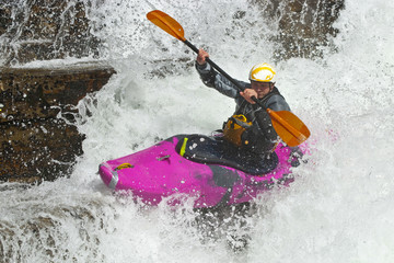 Kayaker in the waterfall