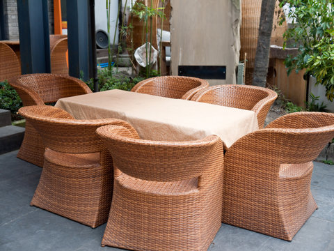 House Patio With Wicker Sofas And Tabel.