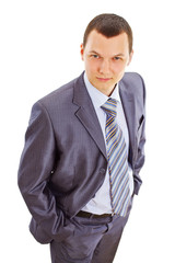 Serious confident young businessman in suit