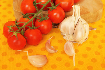 Garlic cloves and cherry tomatoes
