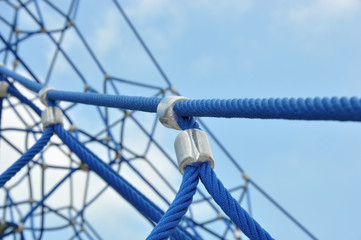 Detailed view of a climbing frame made from thick ropes