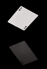 Card falling on black shining surface