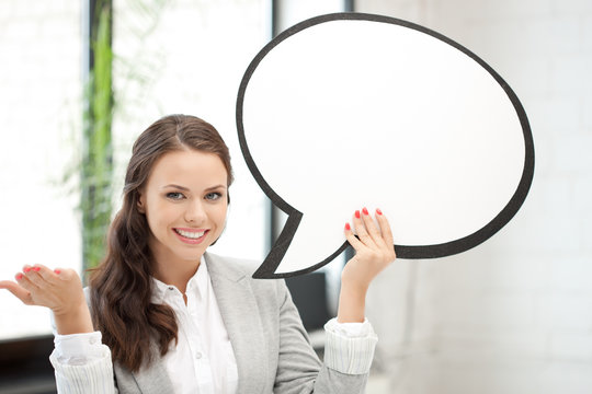 smiling businesswoman with blank text bubble