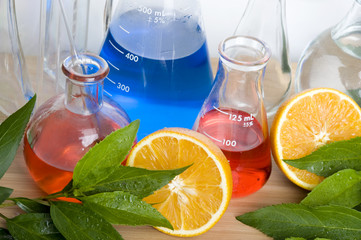 Laboratory flask and orange