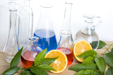 Laboratory flask and orange