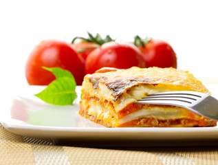 Fototapeta na wymiar Italian lasagna dish with tomatoes