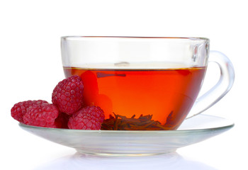 black tea in cup and raspberry isolated on white
