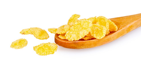 tasty cornflakes in wooden spoon isolated on white