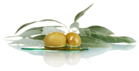 green olives, oil and leaves isolated on white