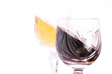 Glasses of red and white wine isolated in white