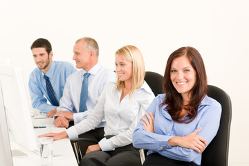 Obraz premium Business team happy sit in line behind table
