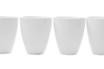 four white cups isolated