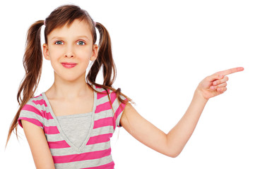 smiley little girl pointing at something