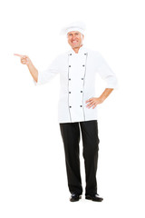 smiley senior chef pointing at something