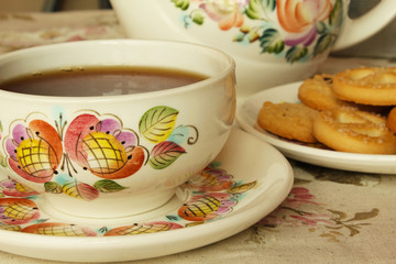 A cup of tea with biscuits