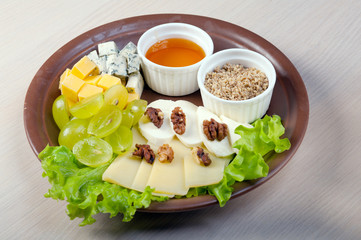 Arrangement ofcheese,grape, nuts