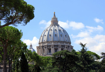 Beautiful basilica surrounded by trees and the blue sky.