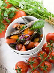 museel with slice fresh tomatoes