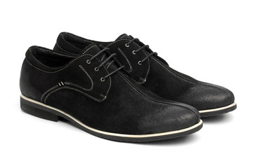 Pair of black male shoes over white