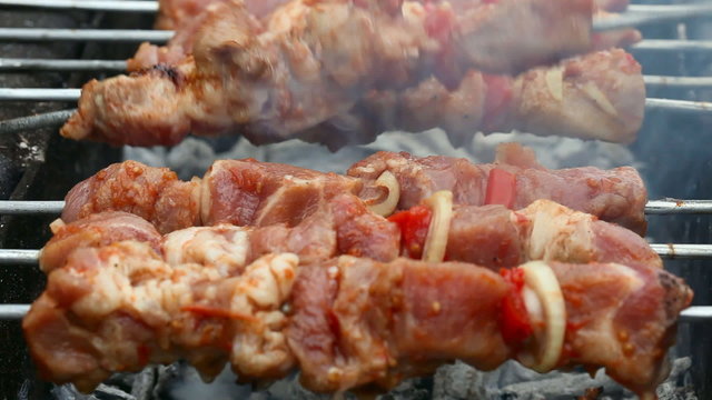 Berbeque preparation by grill.