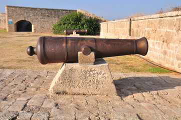 Fototapeta na wymiar Old Gun at the Acre wall. Israel.