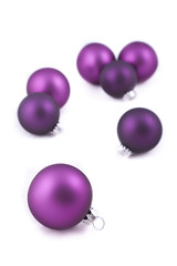 Purple christmas decorations on white background