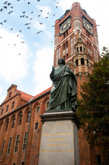 Statue of astronomer Nicholas Copernicus in Torun, Poland - obrazy, fototapety, plakaty