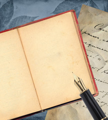 Old book with gold pen