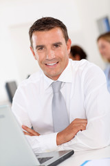 Smiling businessman in office