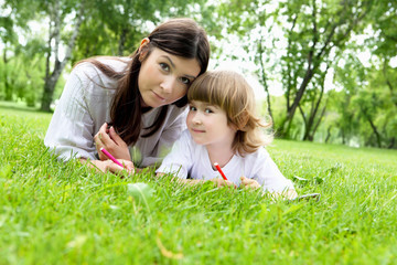 Portrait of mother with daughter outdoor