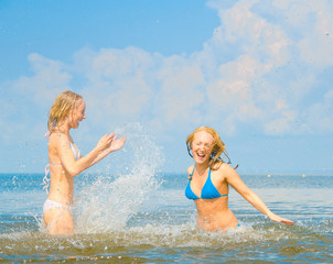 Playing In Water On a Beach - 35425463