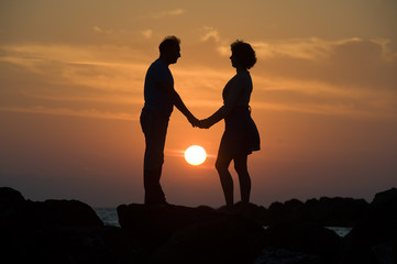Fototapeta na wymiar Couple by sunset