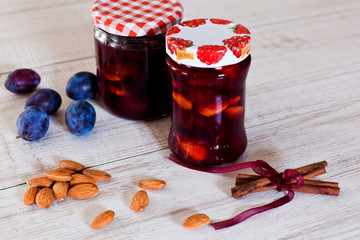 Homemade plum jam with almonds and cinnamon
