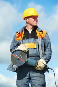 portrait of construction worker with grinder