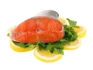 Salmon steak with parsley and lemon isolated