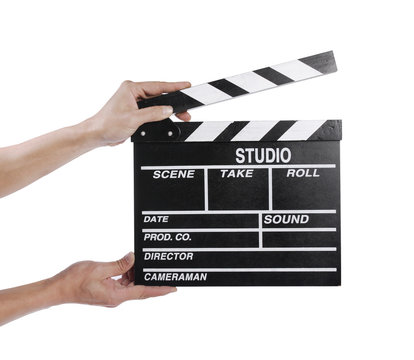 Hands holding out a clapper board in white