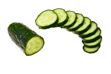 Cucumber half cut and slices isolated over white background.