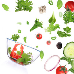 Fresh salad with vegetable in motion.