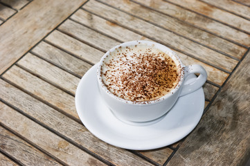 Cappucciono on wooden table
