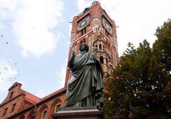 Statue of astronomer Nicholas Copernicus in Torun, Poland - obrazy, fototapety, plakaty