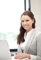 happy woman with laptop computer