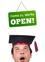 Young persons head looking at closed and open signs