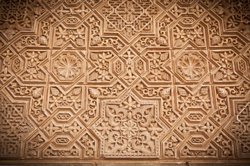 Alhambra de Granada. Arabic relief from Comares facade - obrazy, fototapety, plakaty
