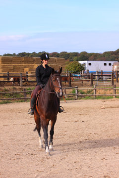 pretty young woman rider in a competition riding