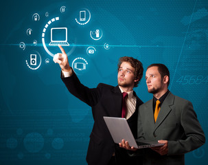 Businessman pressing virtual media type of buttons