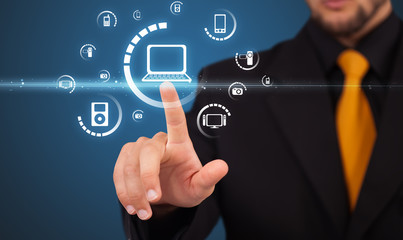 Businessman pressing virtual media type of buttons