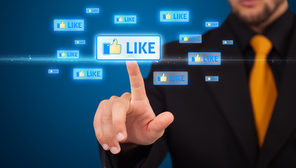Businessman pressing modern social type of icons
