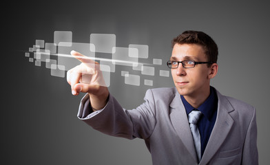 Businessman pressing high tech type of modern buttons