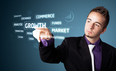 Businessman pressing modern business type of buttons