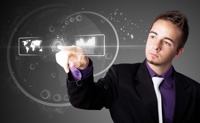 Businessman pressing high tech type of modern buttons